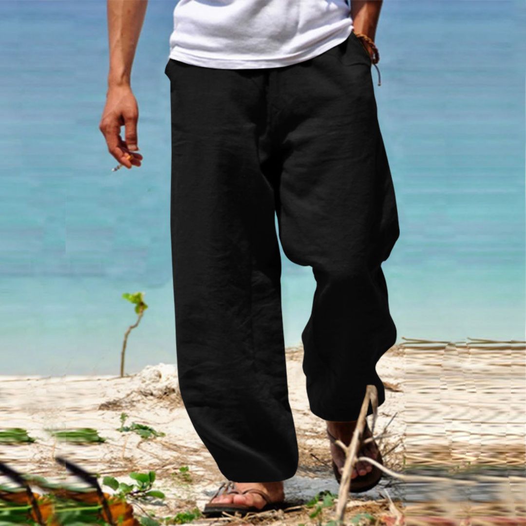 Relaxed fit men's drawstring trousers, ideal for summer beach vacation comfort.