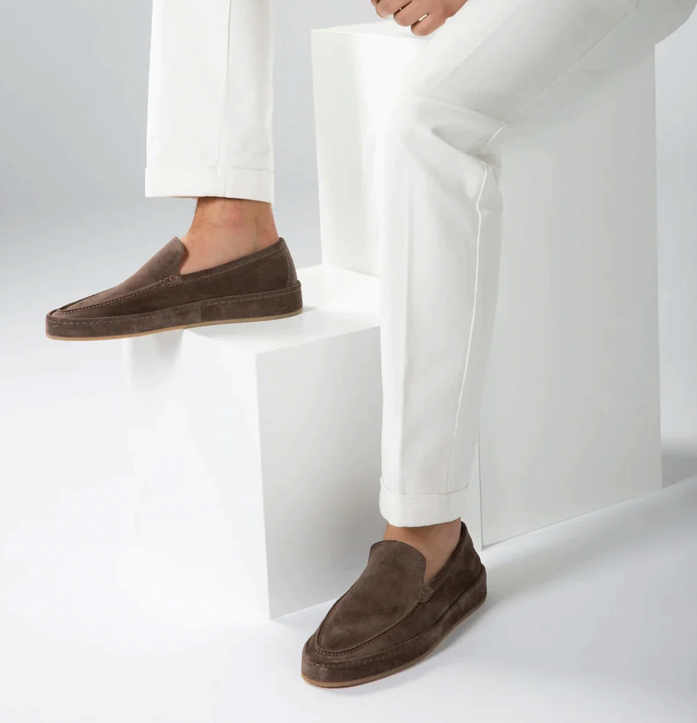 Close-up of men's comfortable loafers showing flexible sole and cushioned insole.