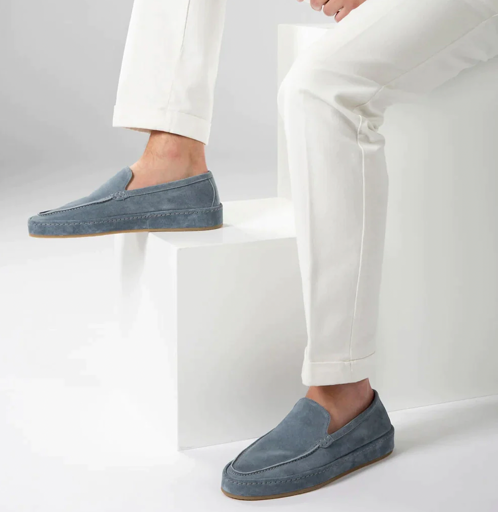Men's navy blue slip-on shoes, versatile footwear for work and weekend casual style.