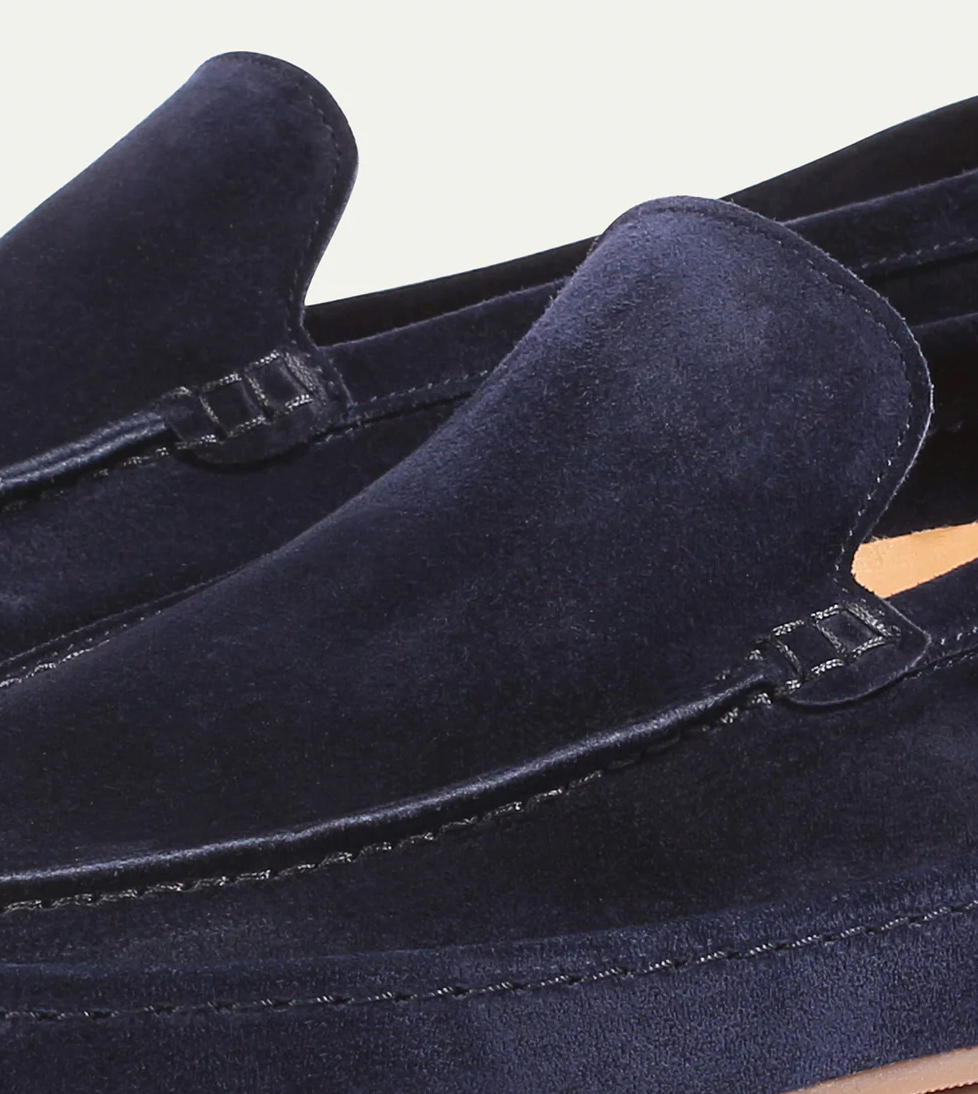 Modern men's slip-on footwear with a sleek design, ideal for smart casual occasions.