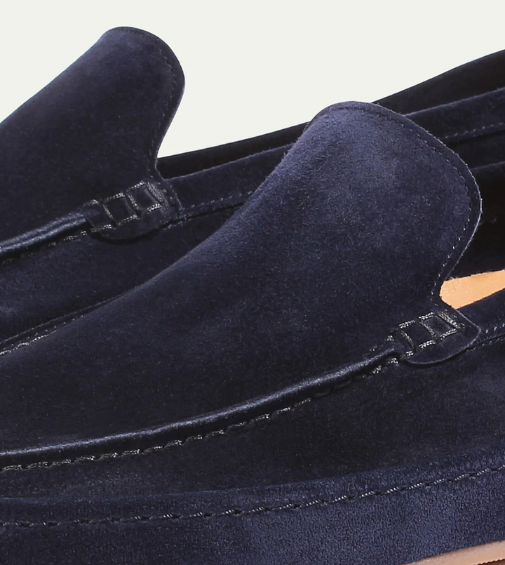 Modern men's slip-on footwear with a sleek design, ideal for smart casual occasions.