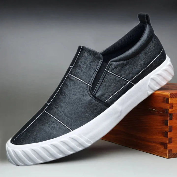 Men's comfortable slip-on loafers with stylish contrast stitching, perfect for casual everyday wear.