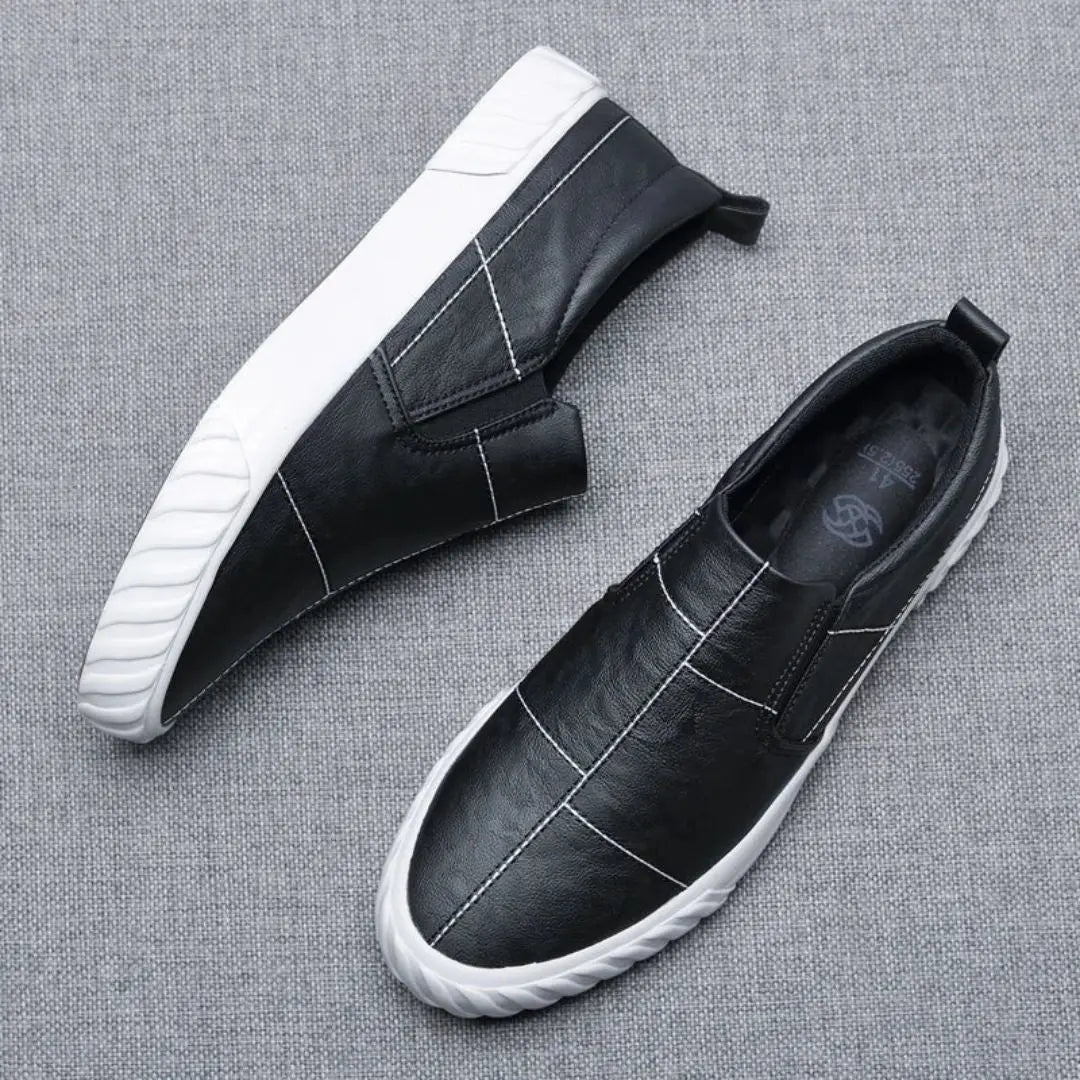 Stylish & comfortable men's slip-on loafers with eye-catching contrast stitching, suitable for casual footwear.