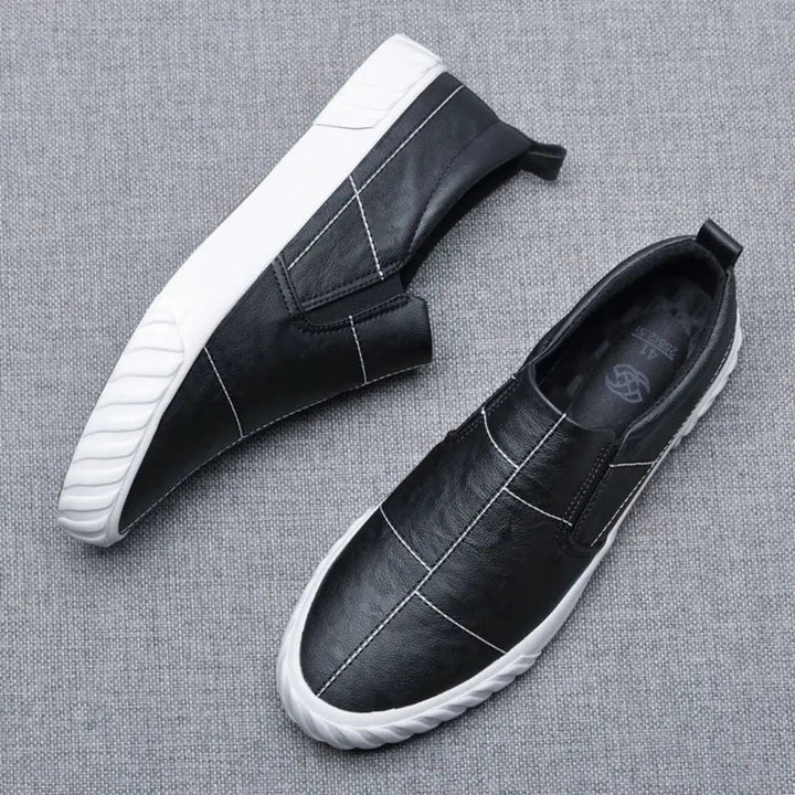 Stylish & comfortable men's slip-on loafers with eye-catching contrast stitching, suitable for casual footwear.