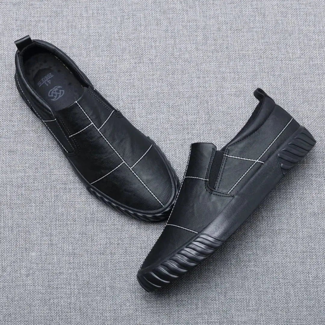 Men's casual slip-on loafers, designed for comfort with stylish contrast stitching. Essential everyday footwear.