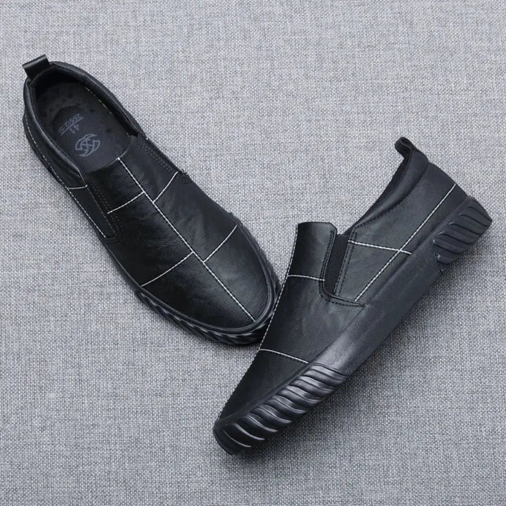 Men's casual slip-on loafers, designed for comfort with stylish contrast stitching. Essential everyday footwear.