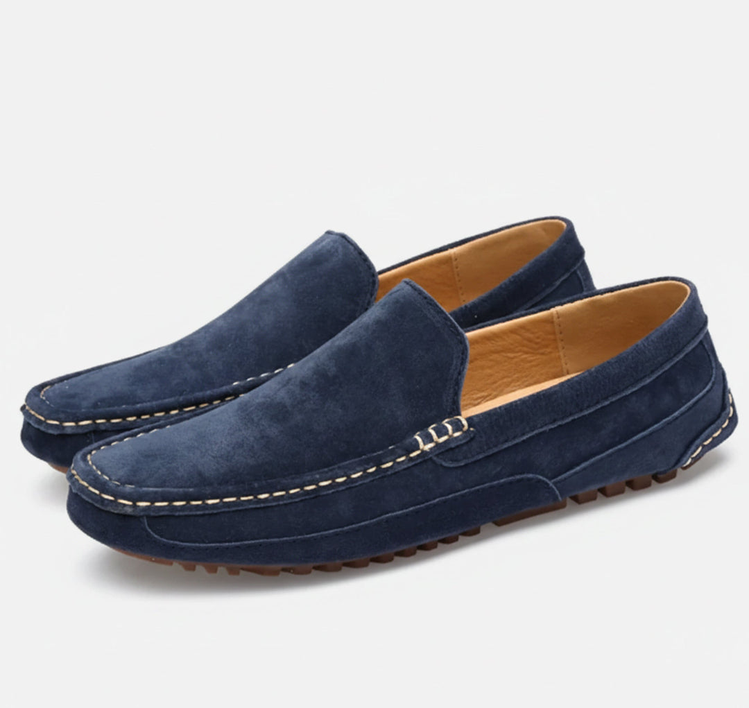 Comfortable men's slip-on shoes on foot. Easy wear, stylish, and timeless casual footwear for versatile use.