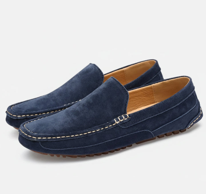 Comfortable men's slip-on shoes on foot. Easy wear, stylish, and timeless casual footwear for versatile use.