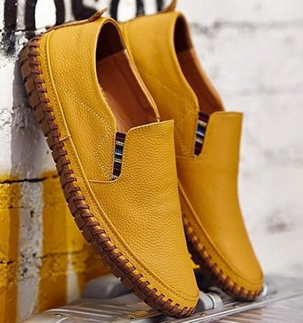 Comfortable men's slip-on shoes with flexible sole, great for everyday casual style & walking comfort.