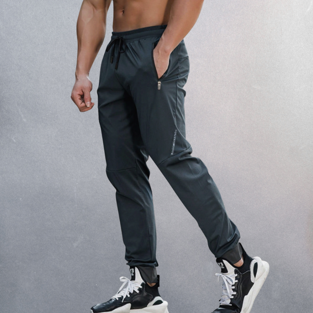 Men's comfortable sport performance pants with elastic waist for athletic activities & casual wear. Ideal for spring fashion.