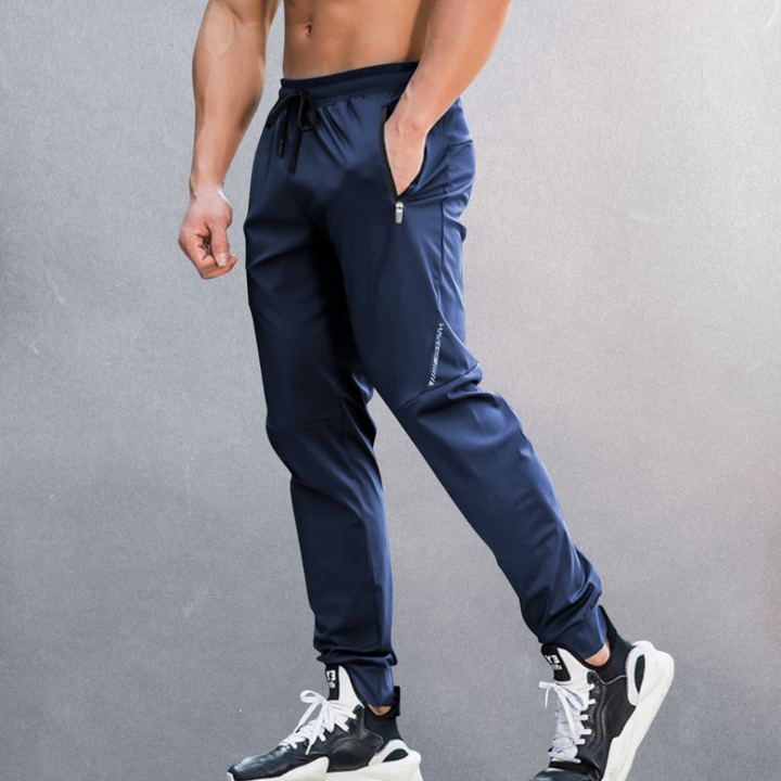 Stylish men's sport performance pants. Elastic waist provides comfort for workouts, travel & casual spring fashion.