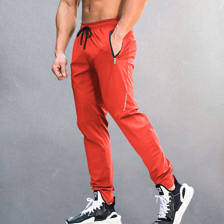 Performance athletic pants for men, offering comfort & flexibility. Great for sports, workouts, or relaxed travel wear.