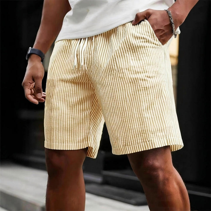 Relaxed fit men's striped casual shorts with a drawstring for ultimate comfort. Ideal for versatile summer weekend wear.