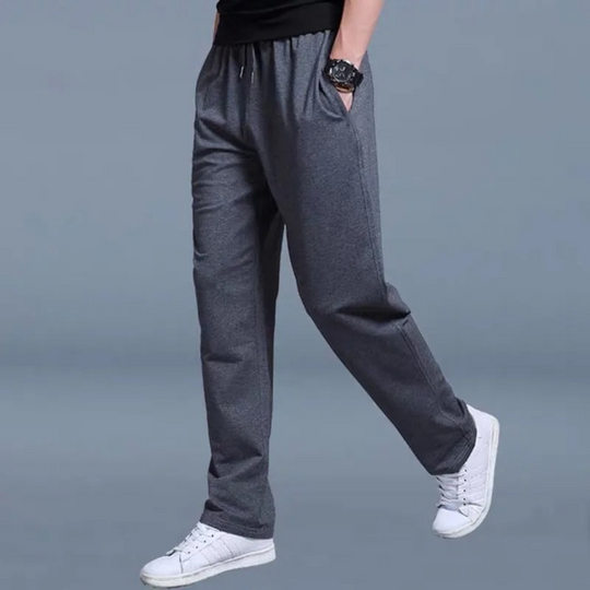 Men's comfortable tapered jogging pants in grey, perfect for lounging at home or intense workouts.