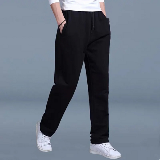 Stylish men's tapered jogging pants, featuring a comfy elastic waistband & side pockets for active lifestyles.