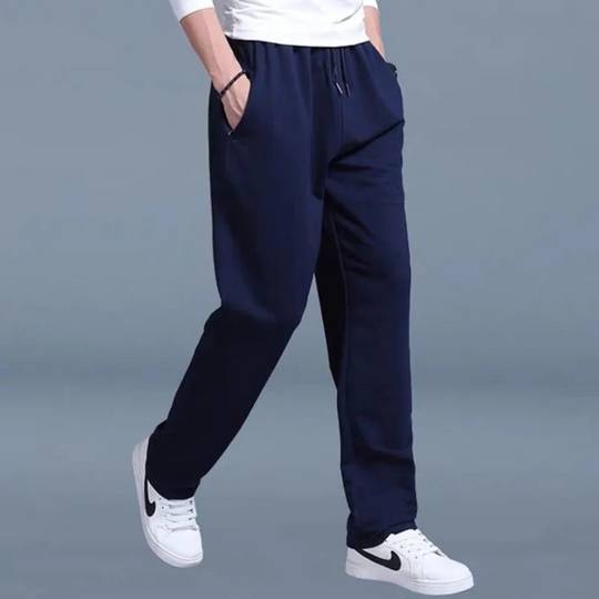 Men's versatile tapered athletic pants in dark blue, designed for ultimate comfort during exercise & relaxation.