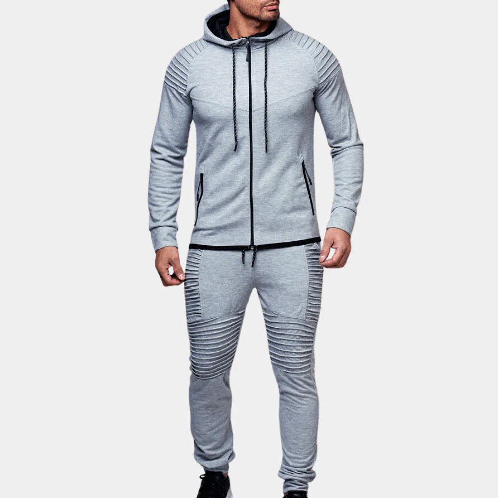 Stylish men's two-piece tracksuit for autumn fashion. Comfortable crewneck top & joggers, great for casual or athletic use.