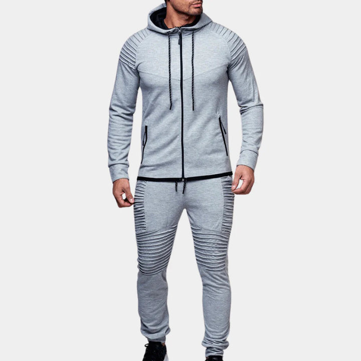 Stylish men's two-piece tracksuit for autumn fashion. Comfortable crewneck top & joggers, great for casual or athletic use.