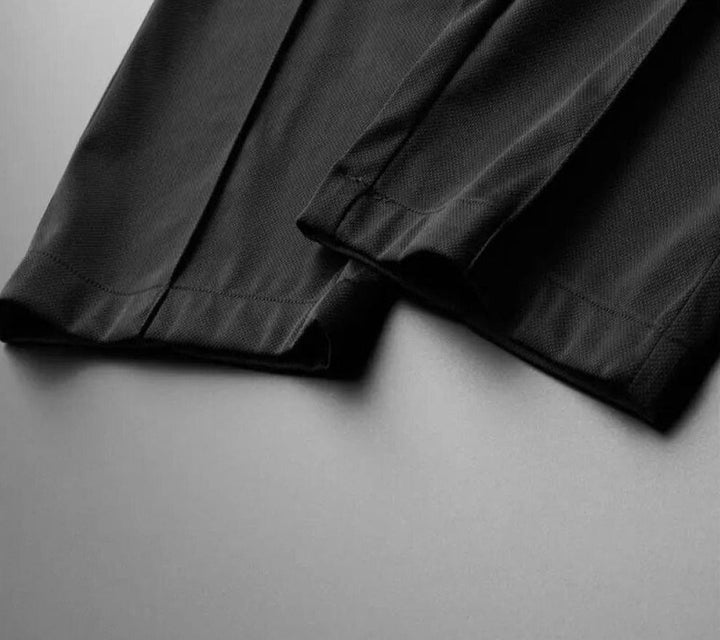 Complete men's casual outfit: a stylish polo shirt and comfortable tapered pants two-piece set.