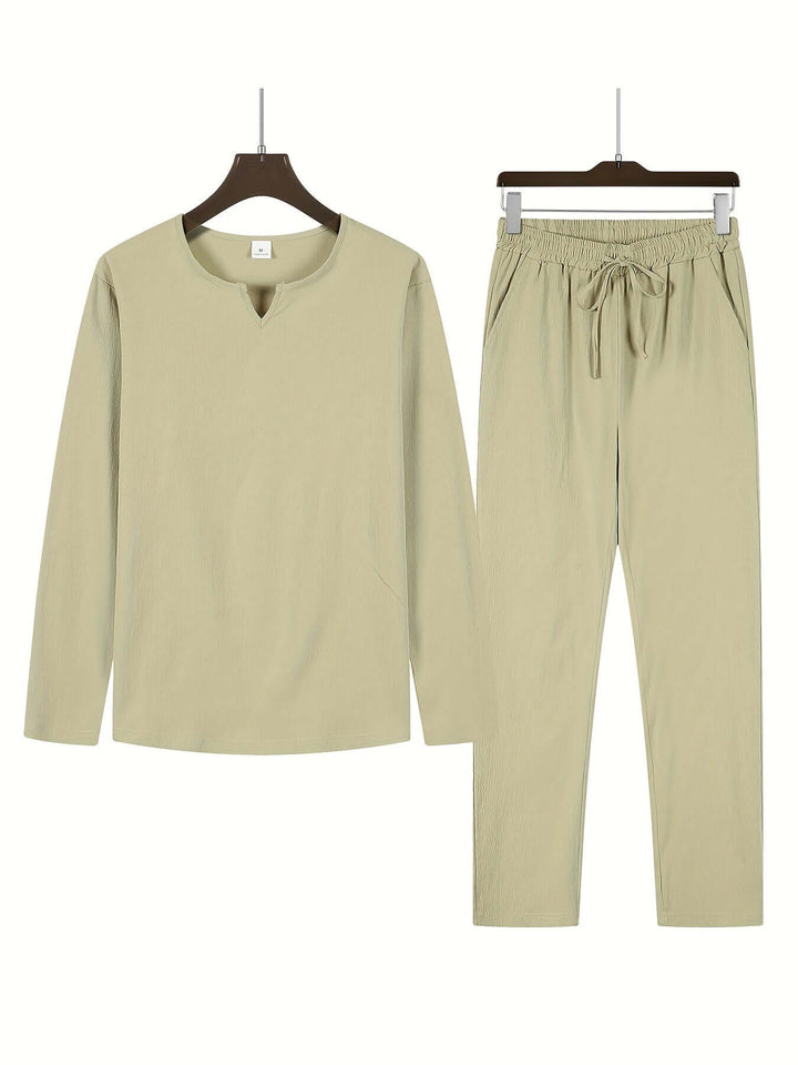 Soft men's V-neck long-sleeve top & relaxed trousers. Comfortable two-piece casual outfit for men.