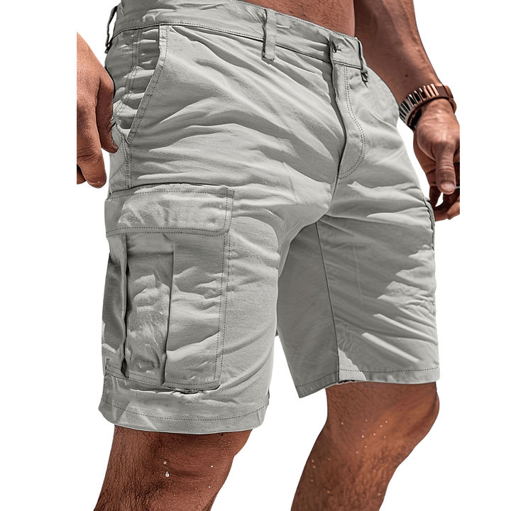 Men's cotton cargo shorts with six pockets, ideal for outdoor adventures & comfort.