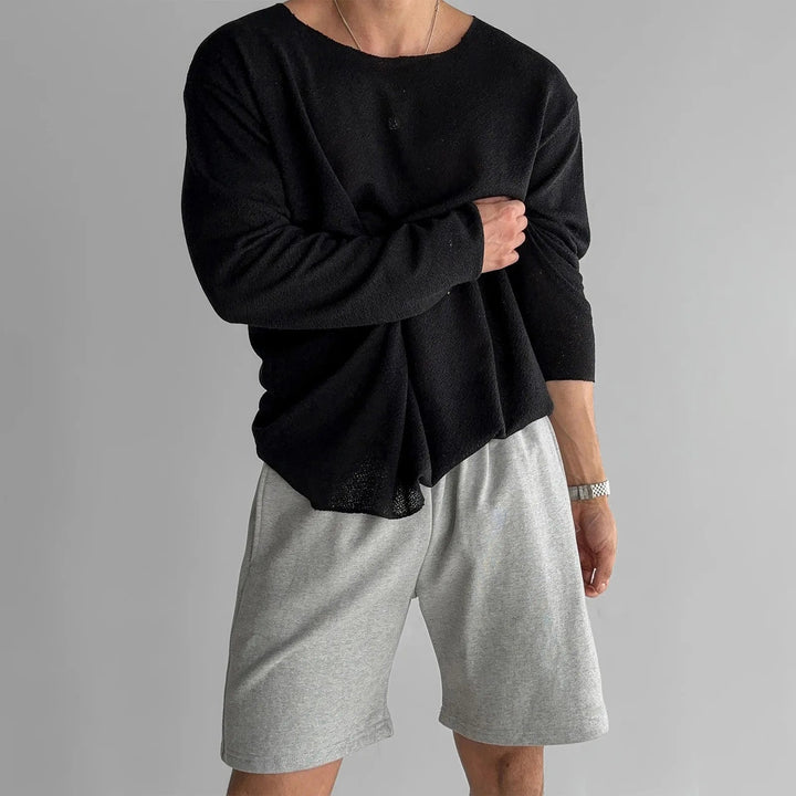 Modern men's long sleeve crew neck shirt with a loose fit for a relaxed spring style.