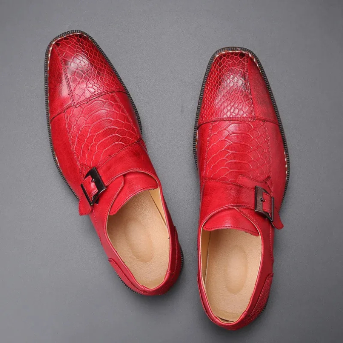 Detail shot: Rich crocodile embossed leather on men's monk strap formal dress shoe buckle.