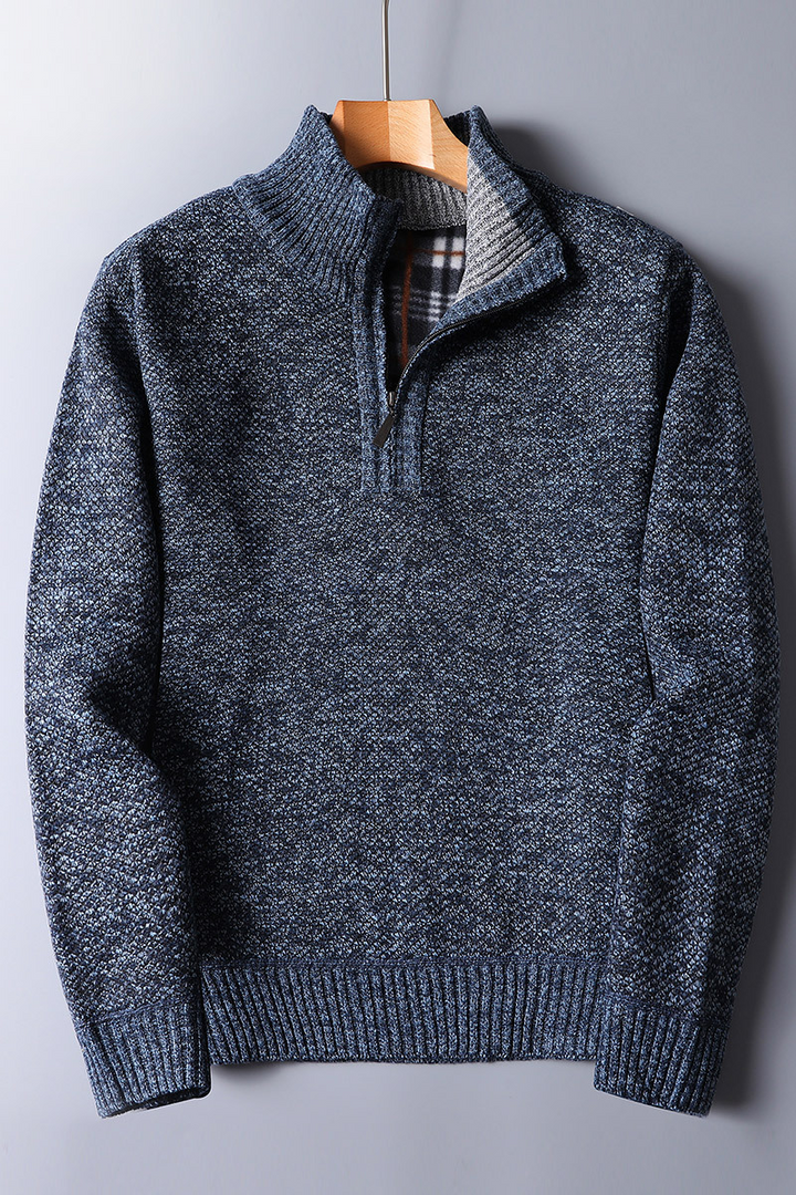 Light gray men's ribbed mock neck quarter zip sweater, a comfortable and stylish addition to men's fall wardrobe.