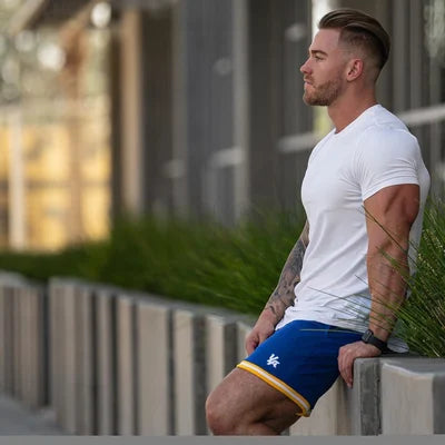 The sleek silhouette of a men's longline deep cut t-shirt.