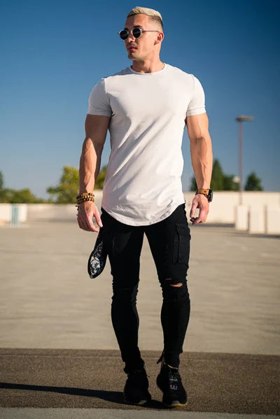 Comfortable tee for men, highlighting the deep cut and relaxed athletic fit.