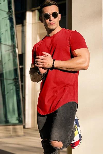 A man enjoying the comfort of a deep cut, stylish t-shirt.