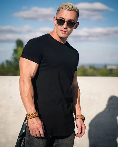 Close-up of the breathable fabric on a men's stylish deep cut t-shirt.