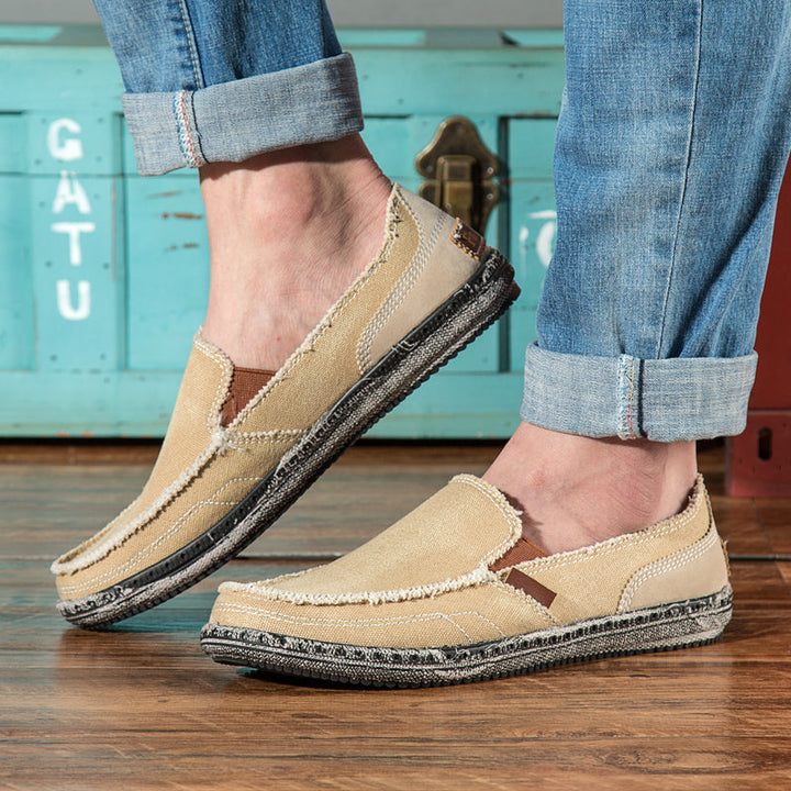 Men's distressed slip-on loafers, perfect for casual comfort and relaxed everyday style.