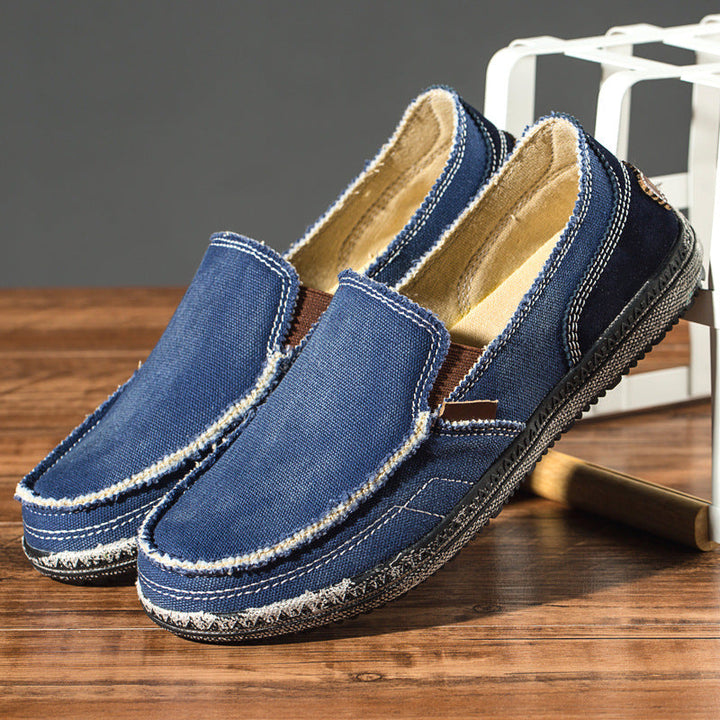 Comfortable men's distressed slip-on loafers with a unique casual style for daily versatile wear.