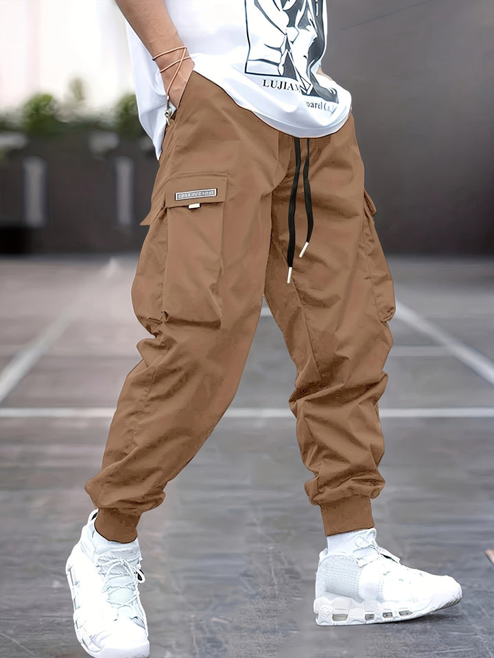 Stylish men's activewear cargo pants with multiple pockets for functionality.