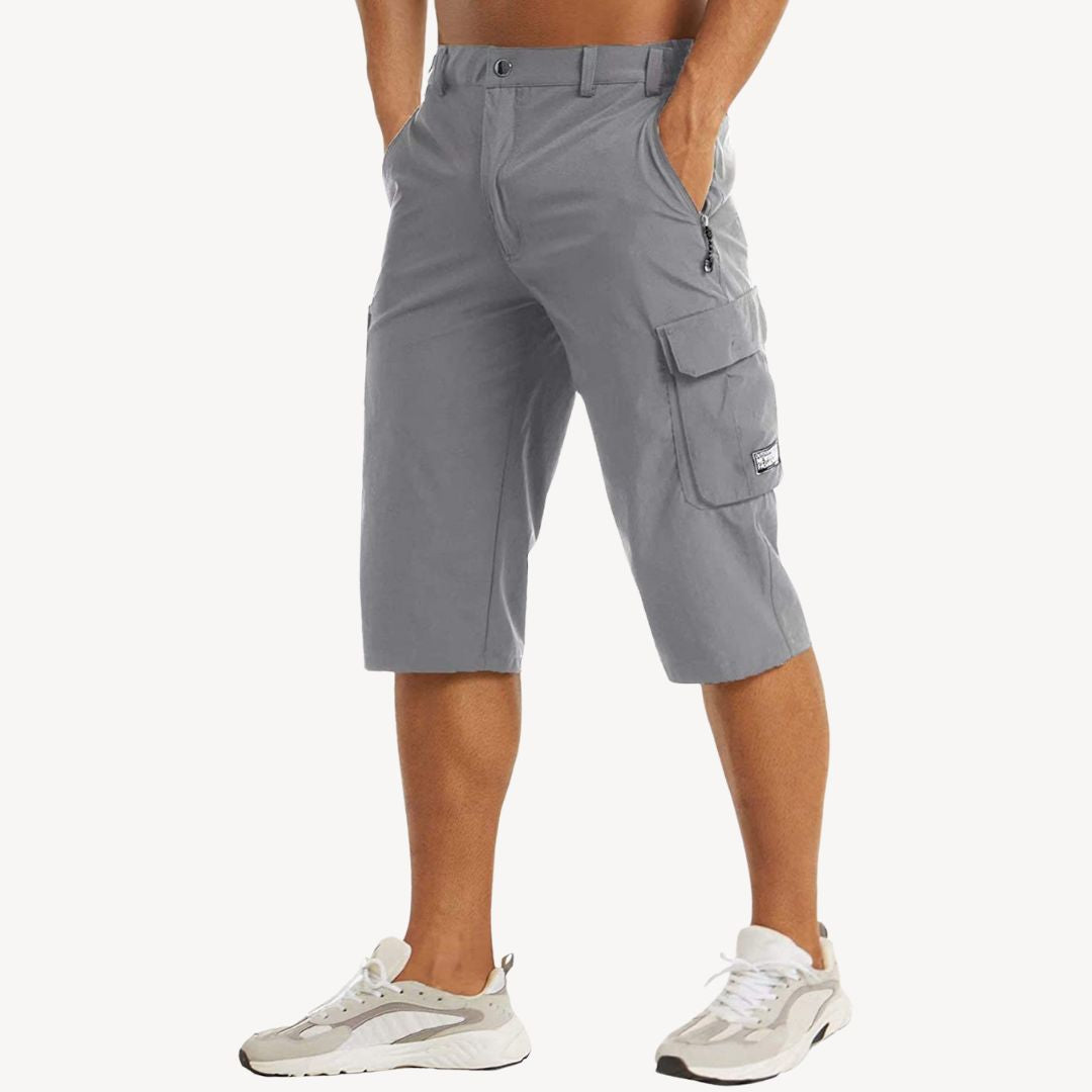 Durable men's utility cargo capri pants, multi-pocket 3/4 trousers designed for active lifestyles.
