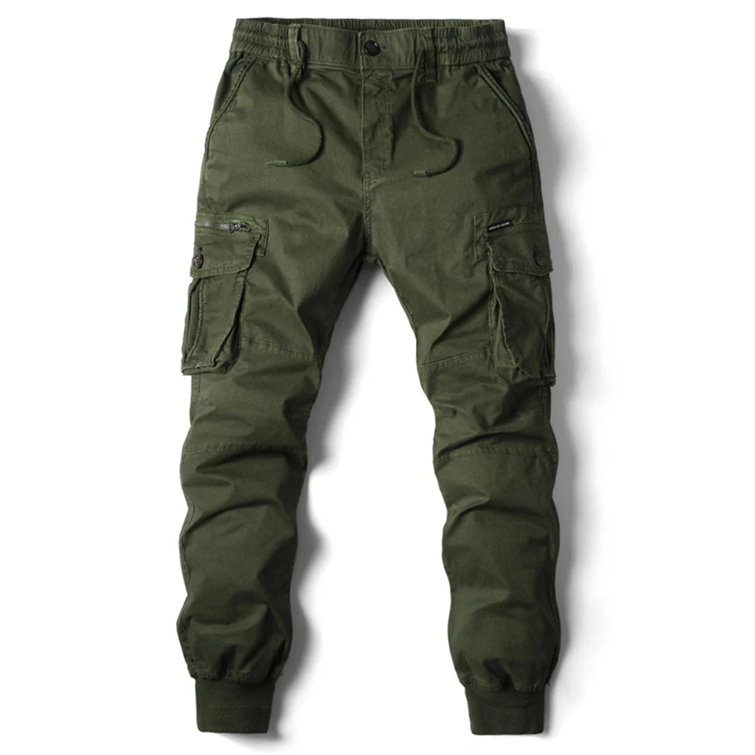Man hiking in functional men's cargo pants, showcasing multi-pockets, durability & adventure readiness.