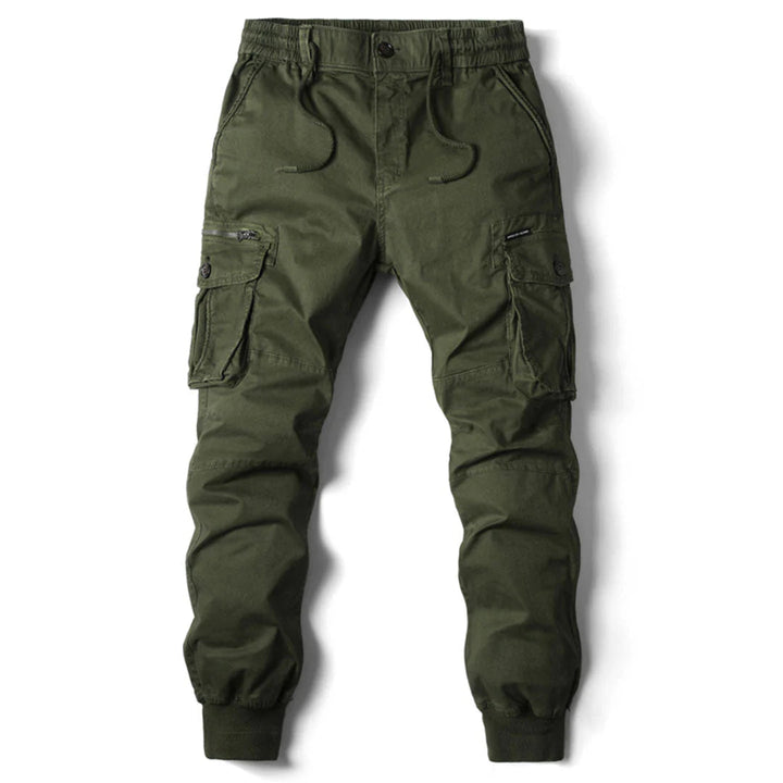 Man hiking in functional men's cargo pants, showcasing multi-pockets, durability & adventure readiness.