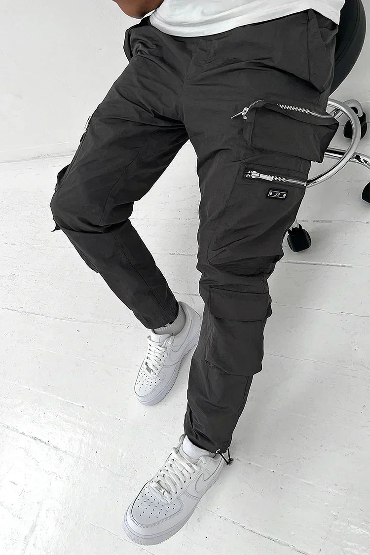 Durable men's utility pants, sturdy cargo trousers featuring multiple practical pockets for everyday use.