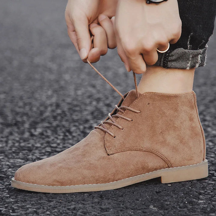 Man wearing sturdy pull-on western boots for casual or outdoor wear.