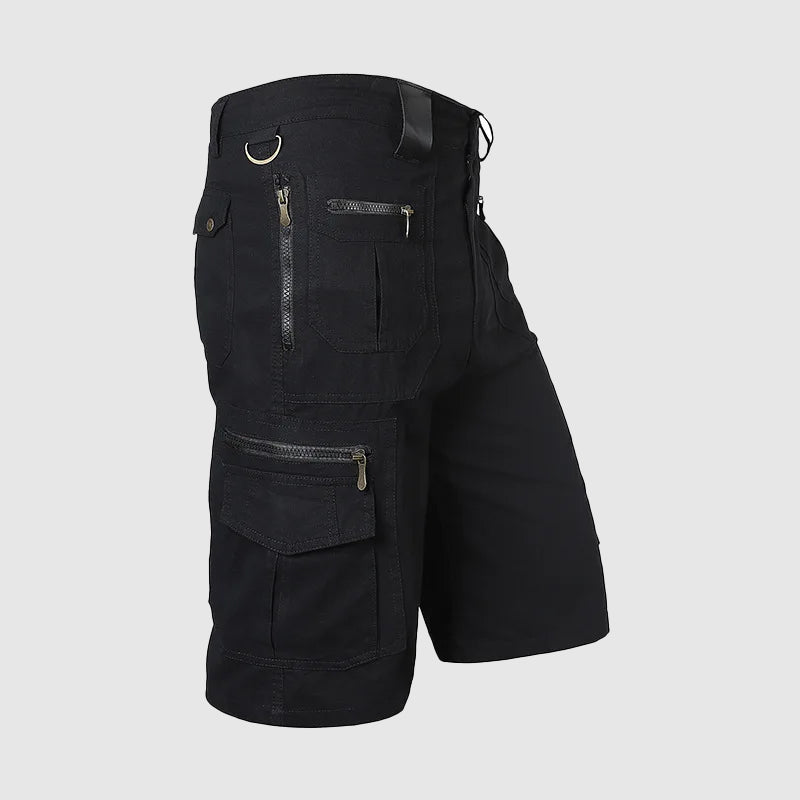 Man in durable knee-length multi-pocket cargo shorts for hiking, outdoor adventure & casual summer wear.