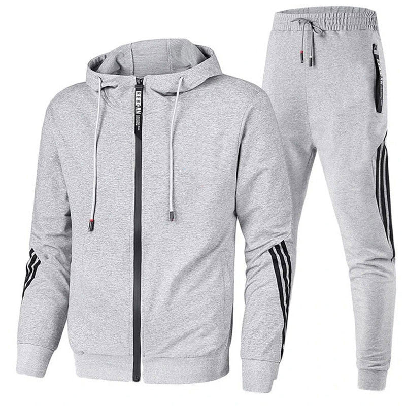 Man running in a modern men's dynamic performance tracksuit set. Perfect running suit for active men's fashion.