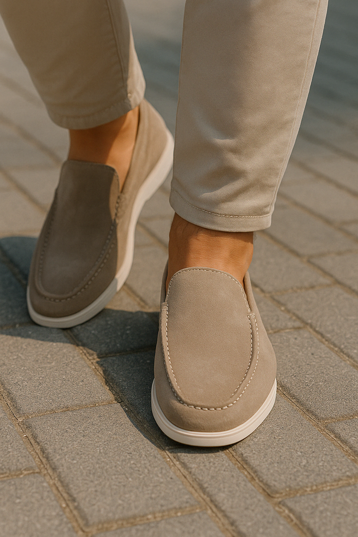 Beige men's comfortable slip-on loafers, casual footwear with a stitched detail, perfect for everyday style.