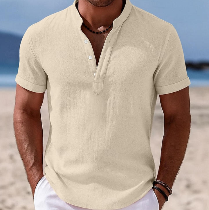 Man in a comfortable, lightweight short sleeve button-up shirt, enjoying summer activities.