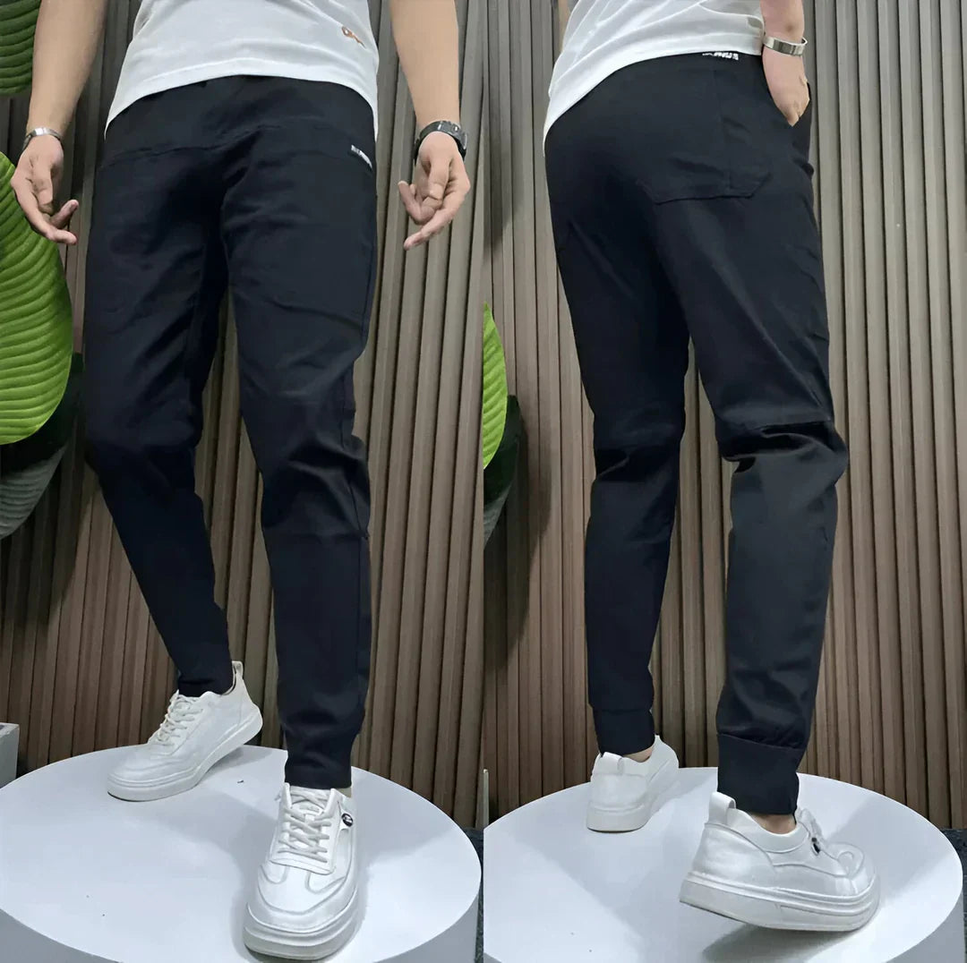 Men's utility cargo pants with multiple pockets, elastic waistband, and stretch fabric for practical, casual everyday wear.
