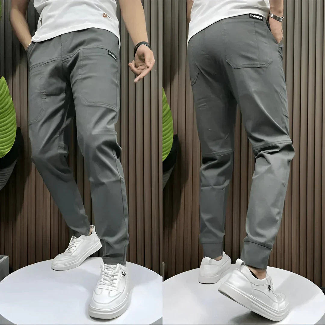 Modern men's elastic cargo pants with multi-pockets & durable fabric, ensuring comfort, utility, and a contemporary look.