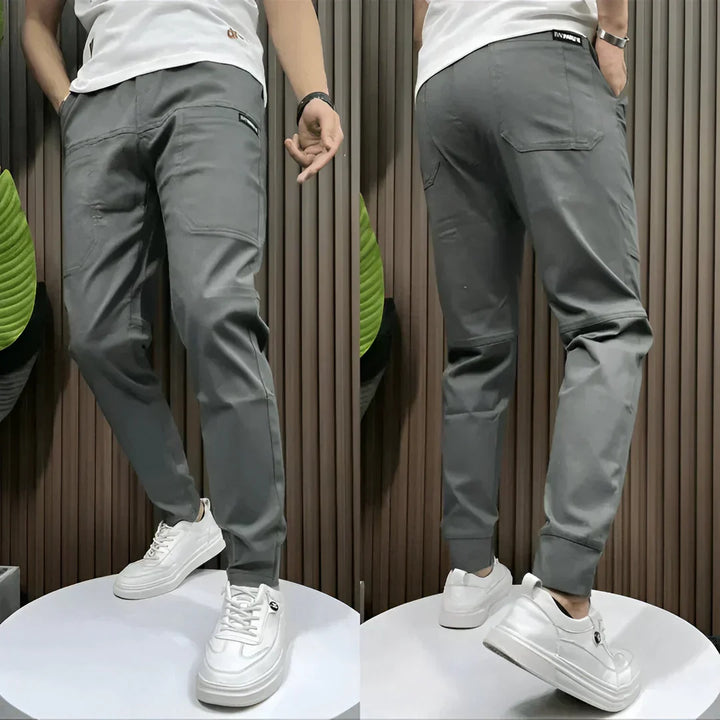 Modern men's elastic cargo pants with multi-pockets & durable fabric, ensuring comfort, utility, and a contemporary look.