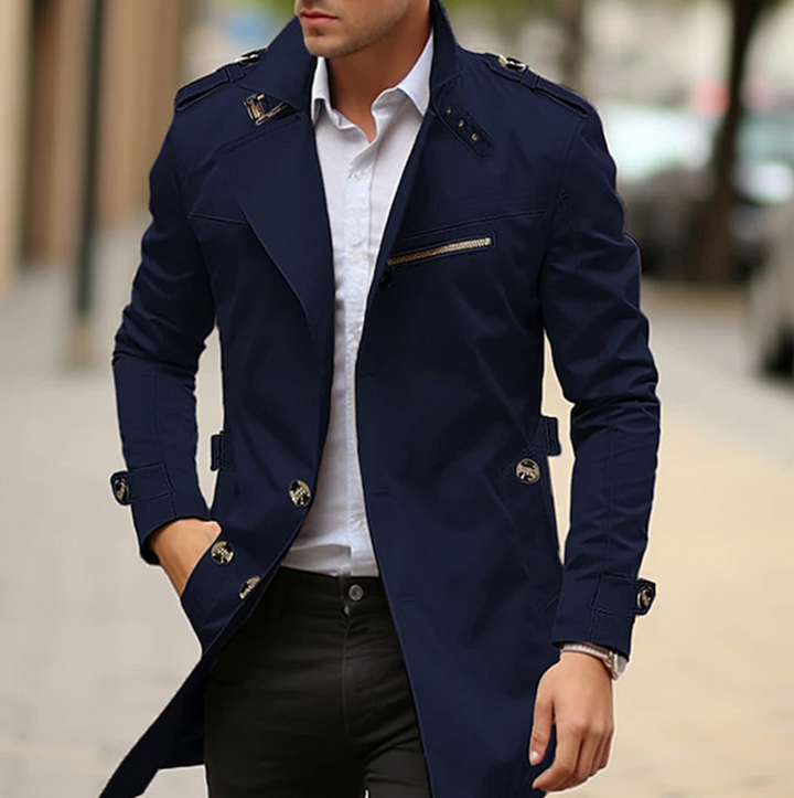 Back view of men's elegant trench coat with vent detail, sophisticated long coat for spring fashion.