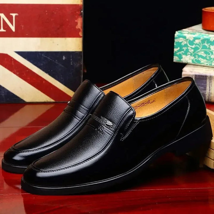 Sophisticated men's black formal slip-on dress shoes, elegant loafers for business and special events.