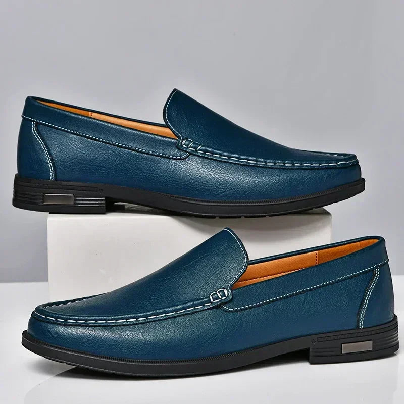 Men's versatile slip-on loafers worn with dress pants, demonstrating elegant style & comfort for any occasion.